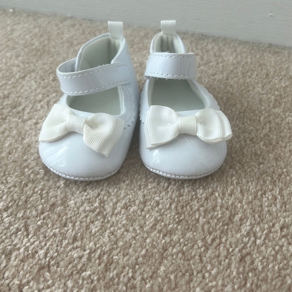 White formal baby shoes.